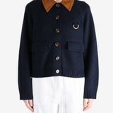 Navy knitwear worn by a person, showing the knitwear fit
