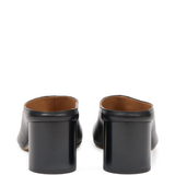 black mules, back view