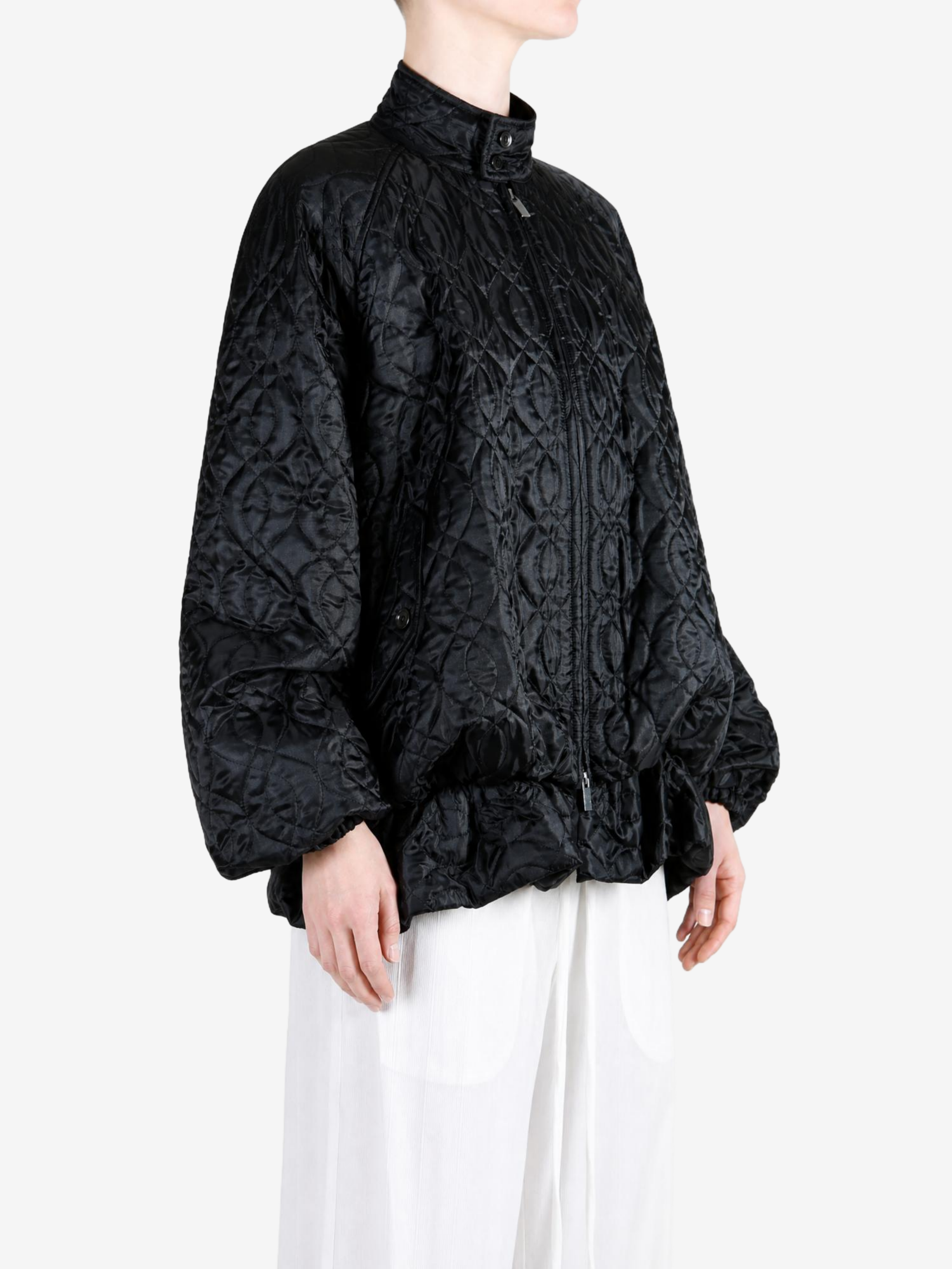 Black jacket worn by a person, showing the jacket fit