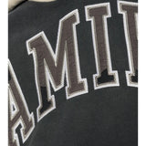 Close up of Black t-shirt, showing texture of the 100% cotton fabric