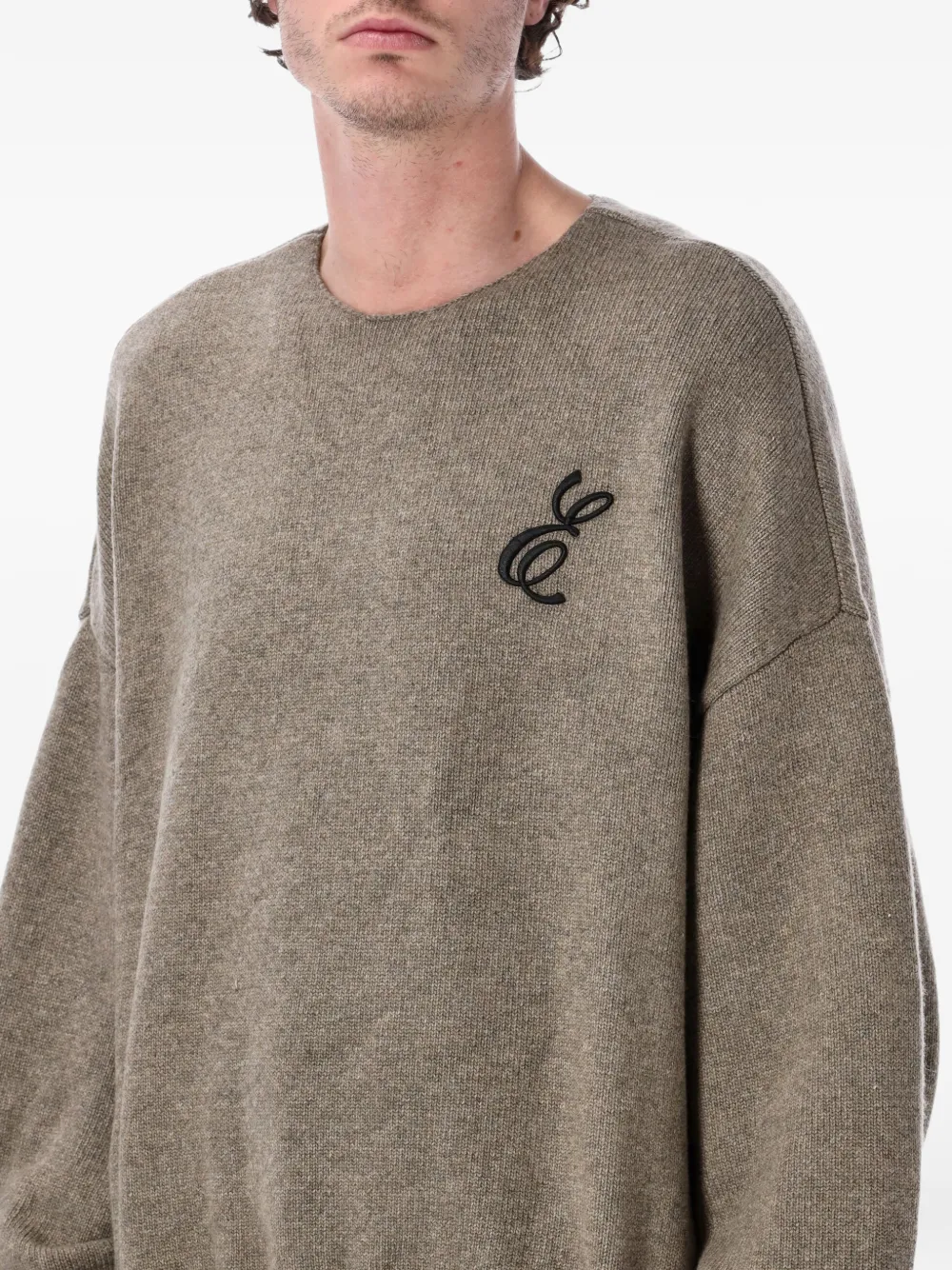 Close up of brown sweater, showing texture of the Acrylic fabric