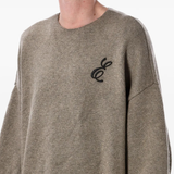 Close up of brown sweater, showing texture of the Acrylic fabric