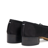 Close up of black shoe,showing texture of the cotton fabric