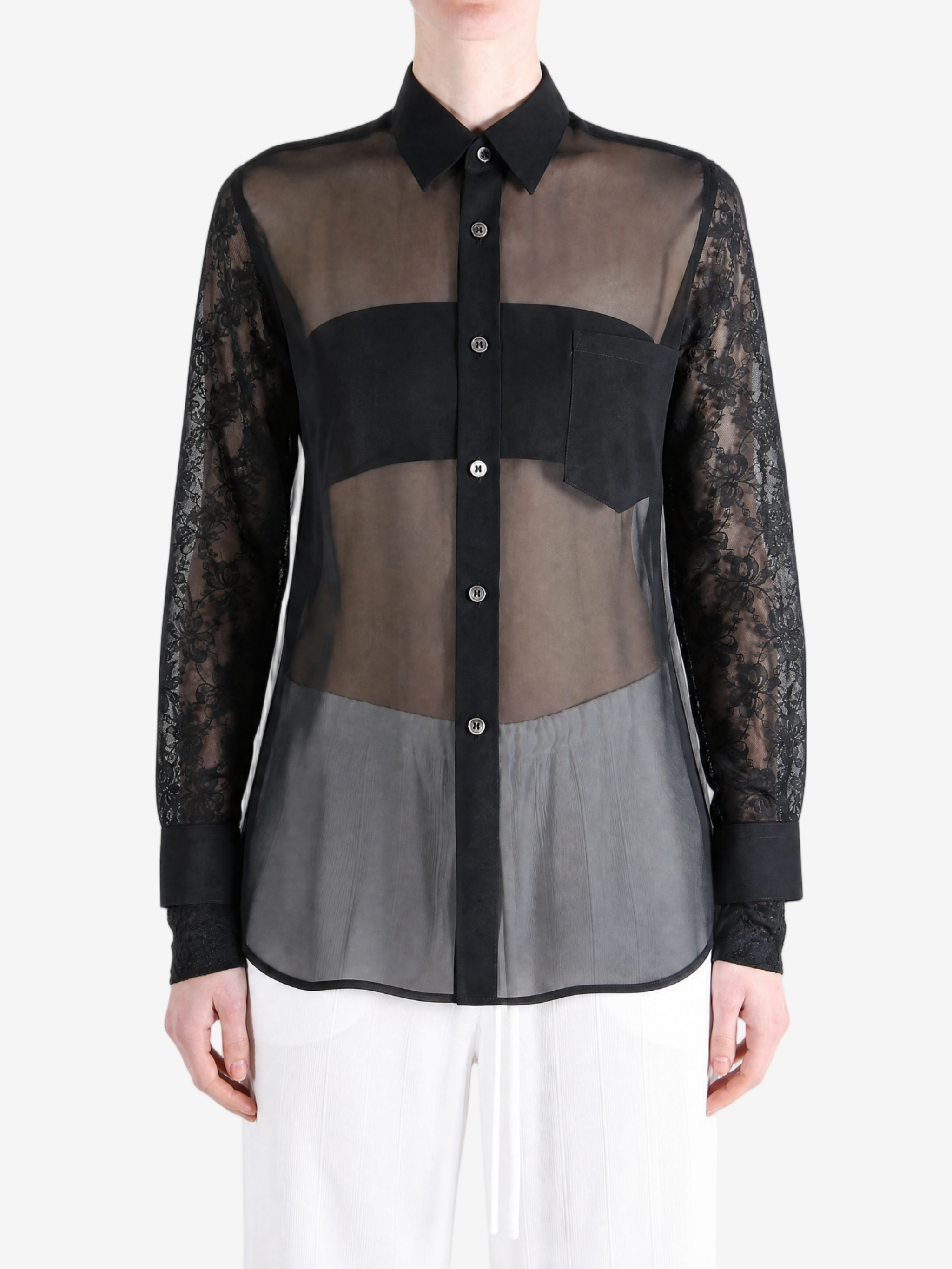 Black top worn by a person, showing the top fit