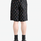 Black short worn by a person, showing the  shorts fit