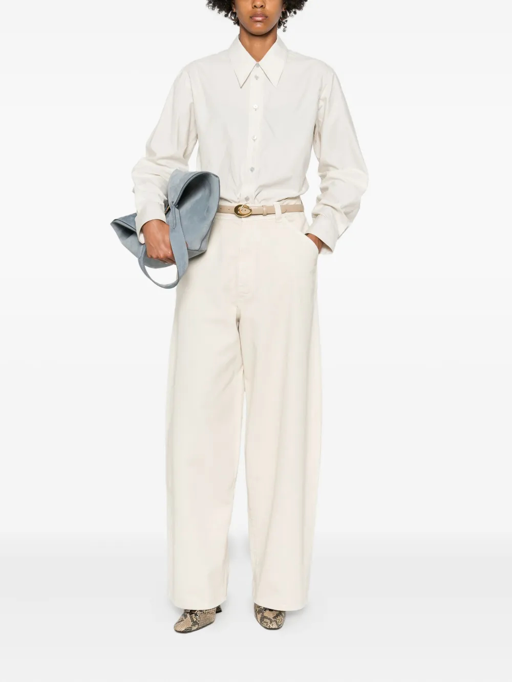 White shirt worn by a person, showing the shirt's fit