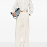 White shirt worn by a person, showing the shirt's fit