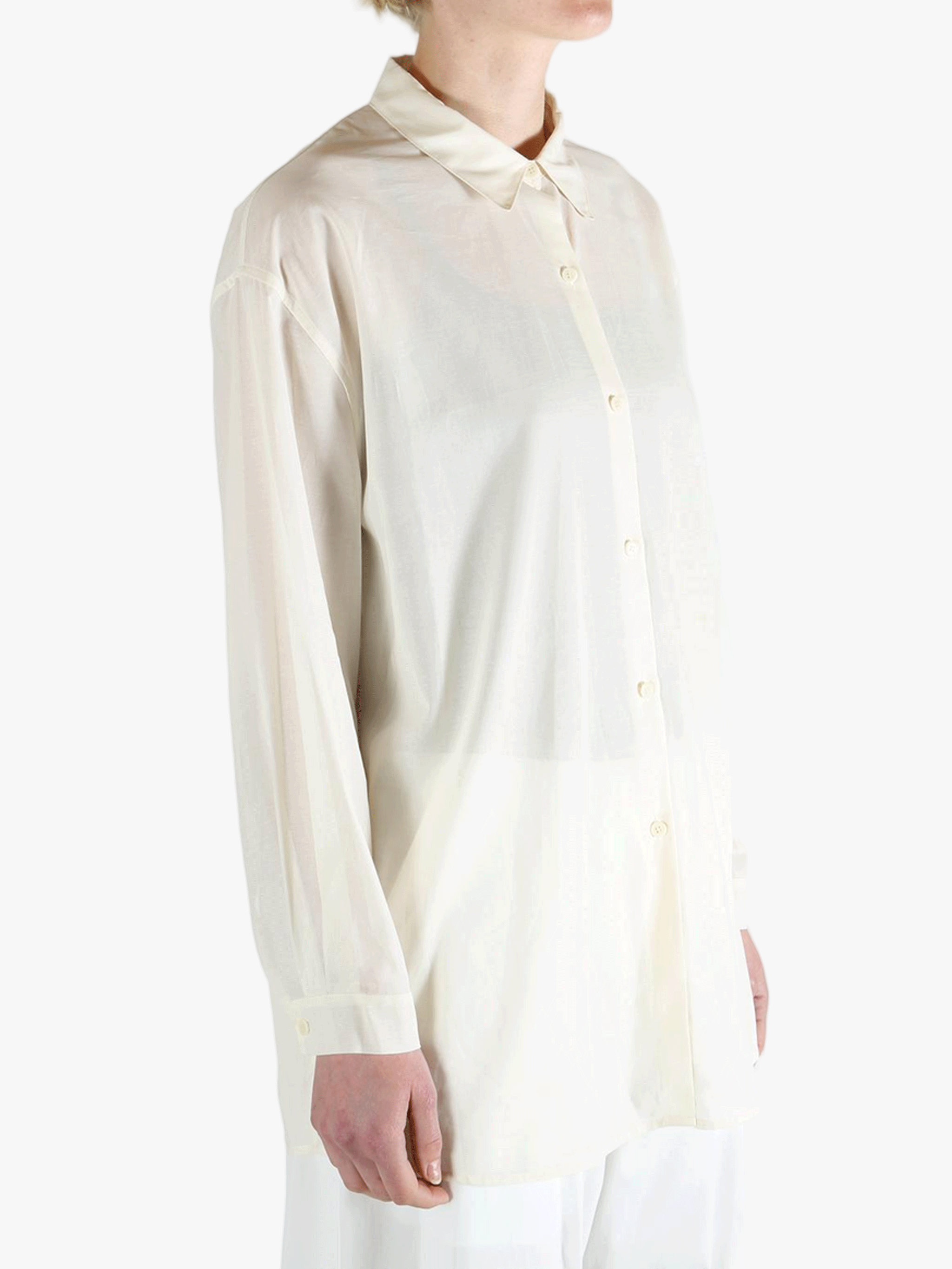 White shirt worn by a person, showing the shirt's fit