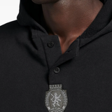 Close up of black hoodie, showing texture of the cotton fabric