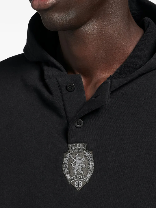 Close up of black hoodie, showing texture of the cotton fabric