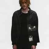 Black shirts worn by a person, showing the shirts fit