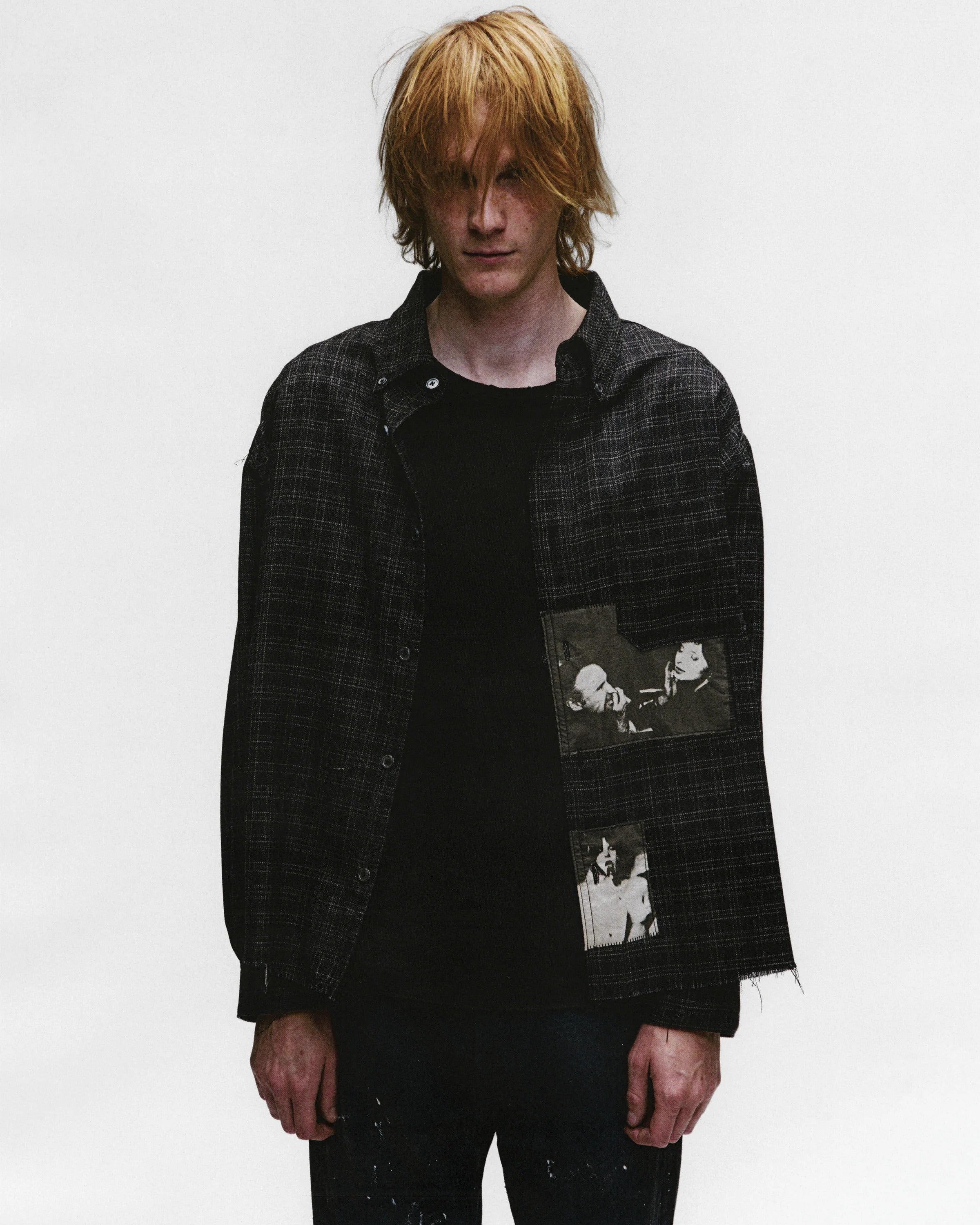 Black shirts worn by a person, showing the shirts fit