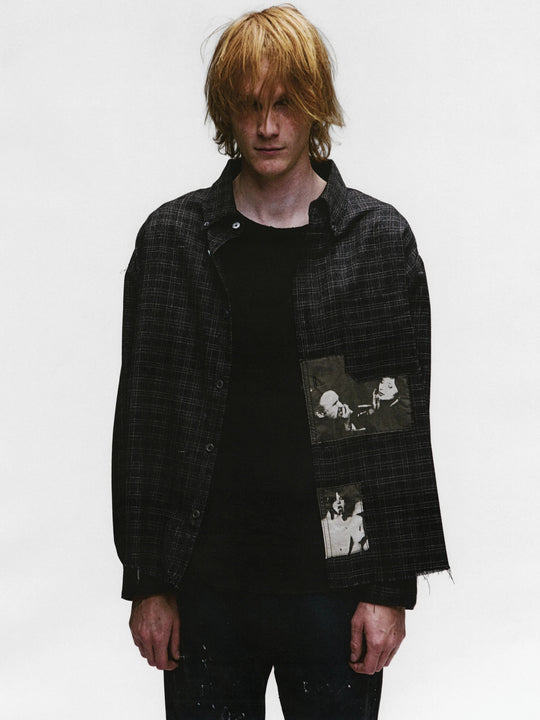 Black shirts worn by a person, showing the shirts fit