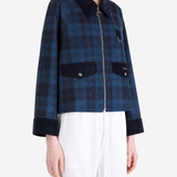 Blue jacket worn by a person, showing the jacket fit