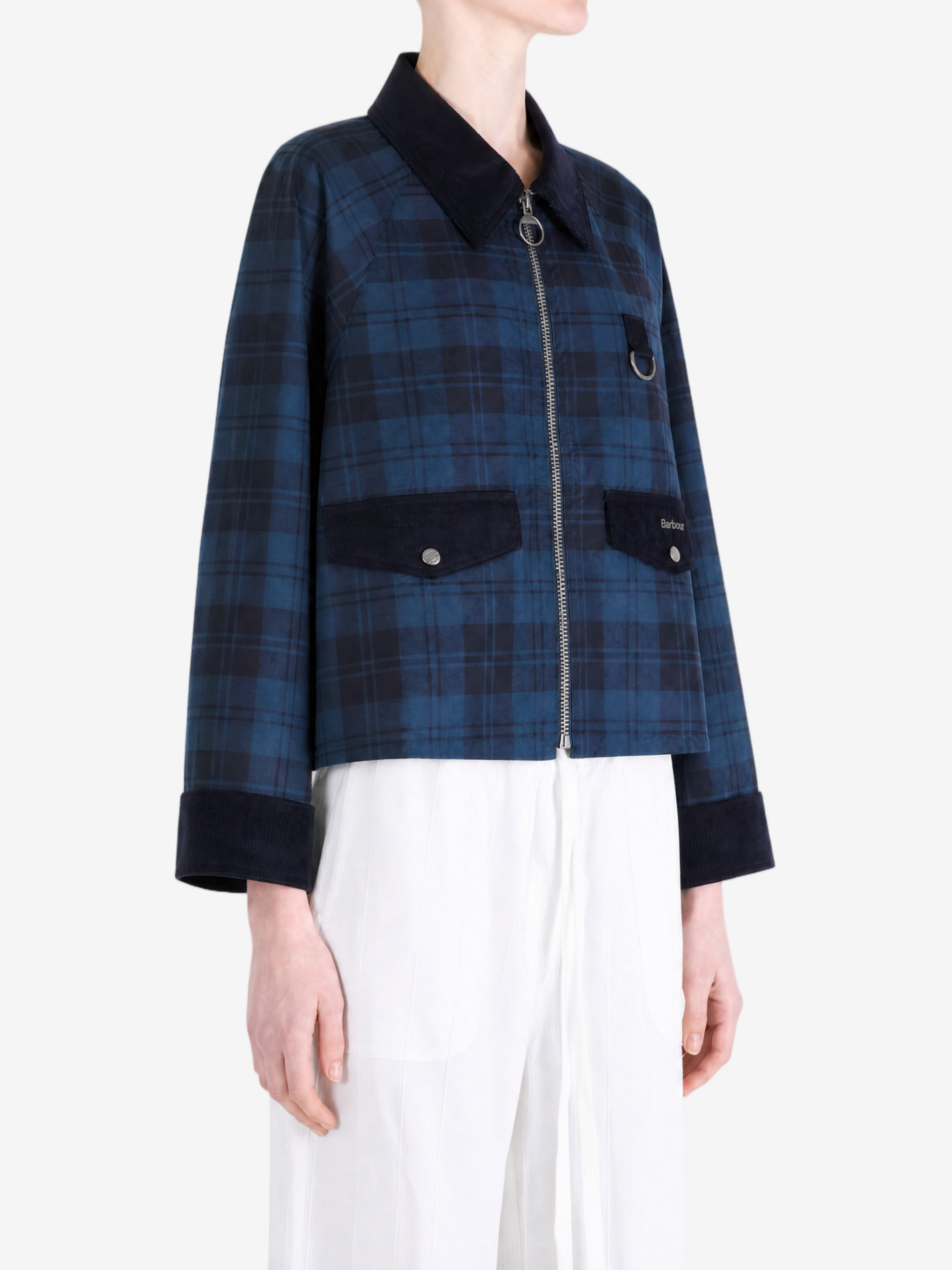 Blue jacket worn by a person, showing the jacket fit