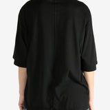 Black t-shirt worn by a person, showing the shirt's fit