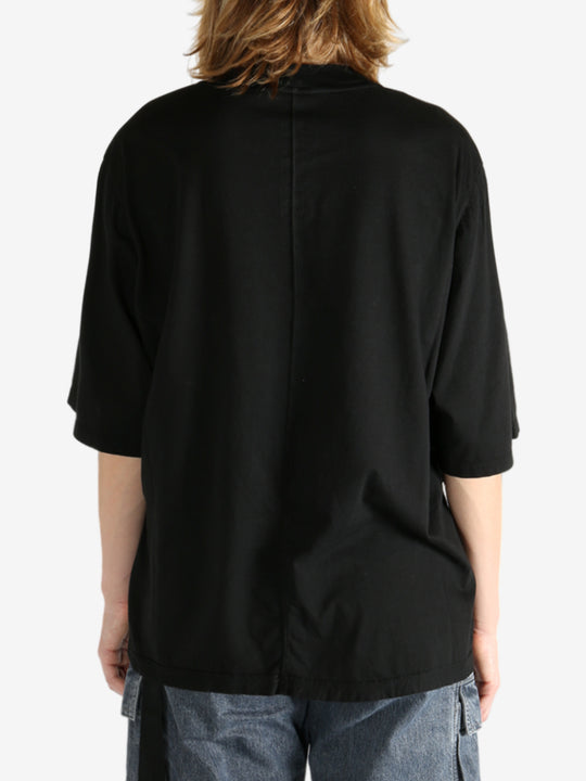 Black t-shirt worn by a person, showing the shirt's fit