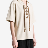 Tan t-shirt worn by a person, showing the t-shirt fit