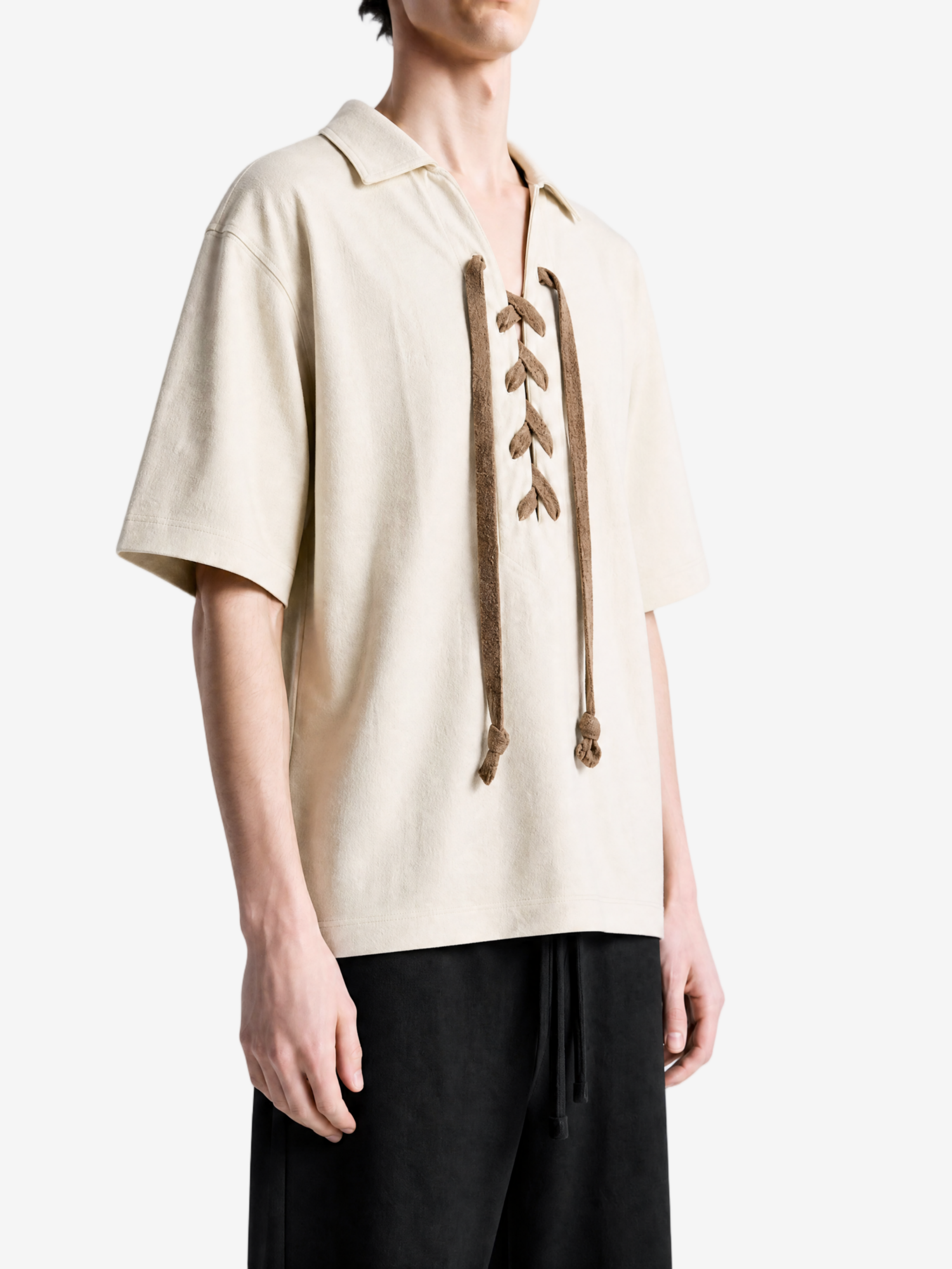 Tan t-shirt worn by a person, showing the t-shirt fit