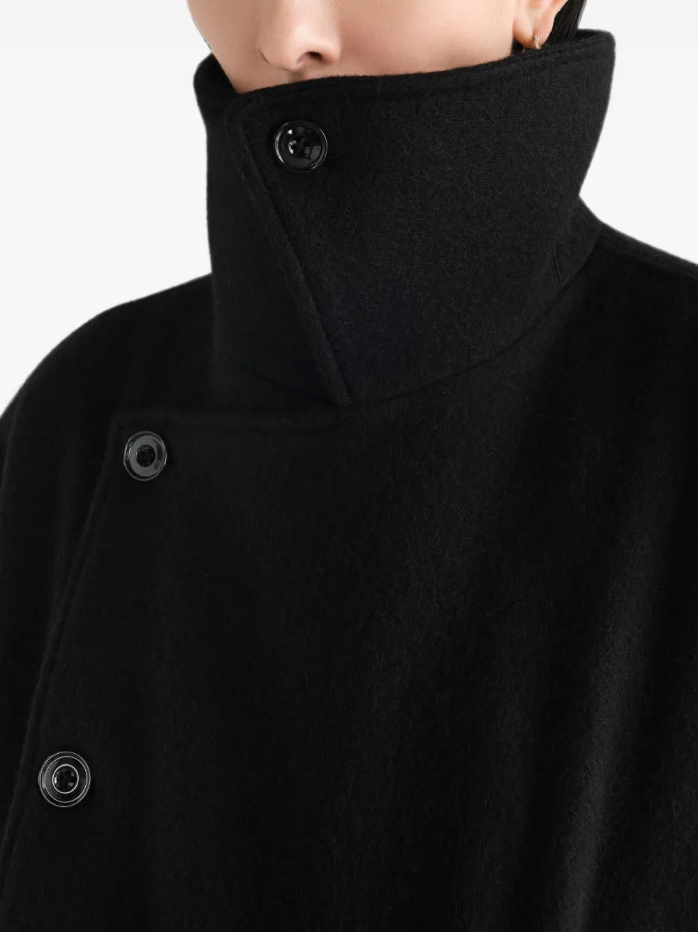 Black jacket worn by a person, showing the jacket fit