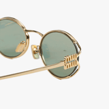 Close up of the green sunglasses, showing texture of the metal fabric