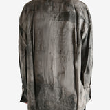 Grey shirt worn by a person, showing the shirt's it