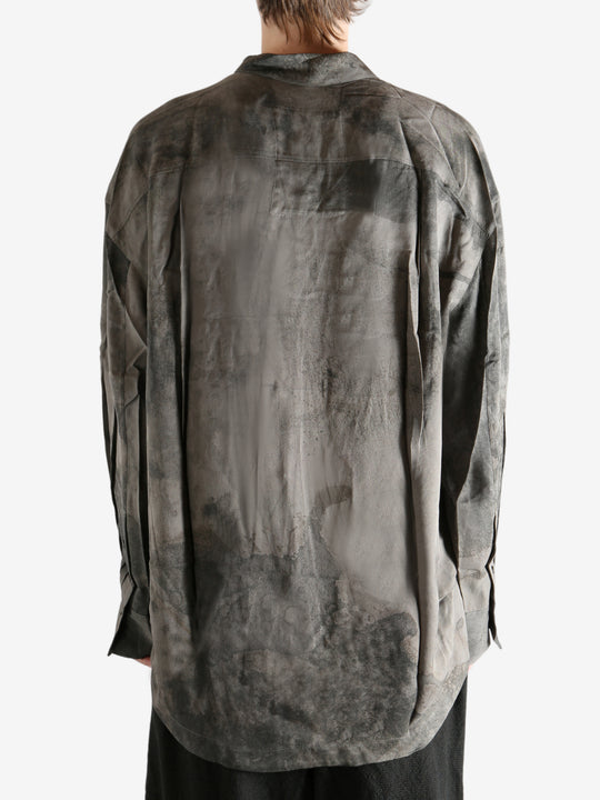 Grey shirt worn by a person, showing the shirt's it