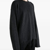 Black top worn by a person, showing the top fit
