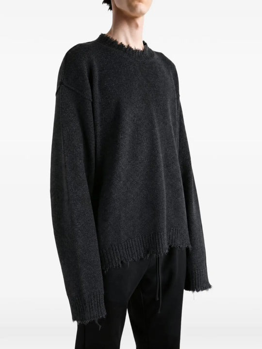 Black top worn by a person, showing the top fit