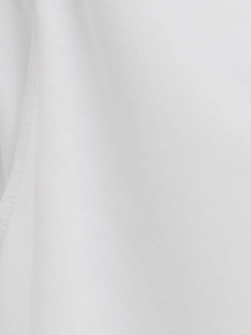 Close up of White top, showing texture of the 96% cotton/ 4% elastane fabric