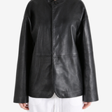 Black jacket worn by a person, showing the jacket fit