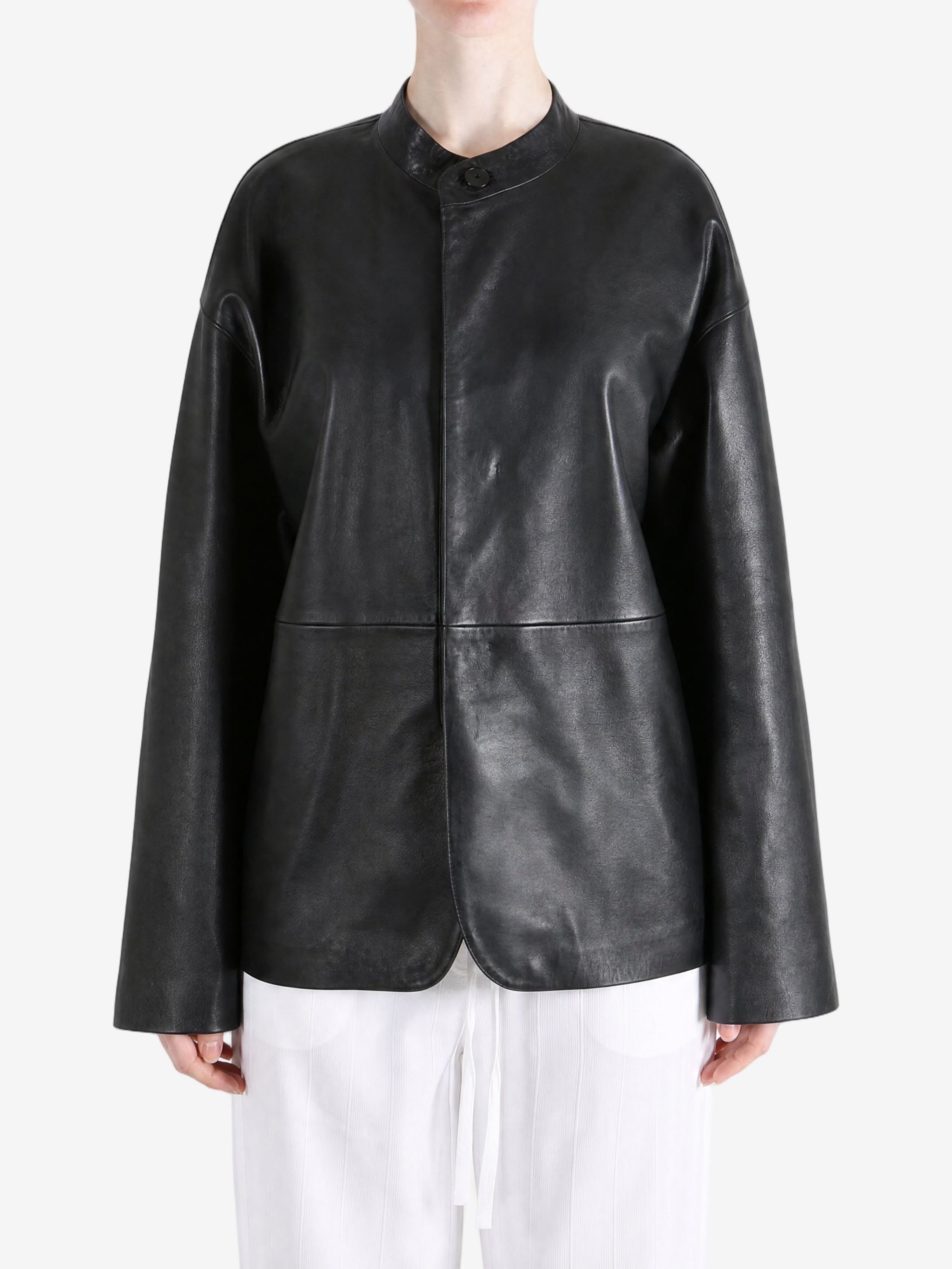 Black jacket worn by a person, showing the jacket fit