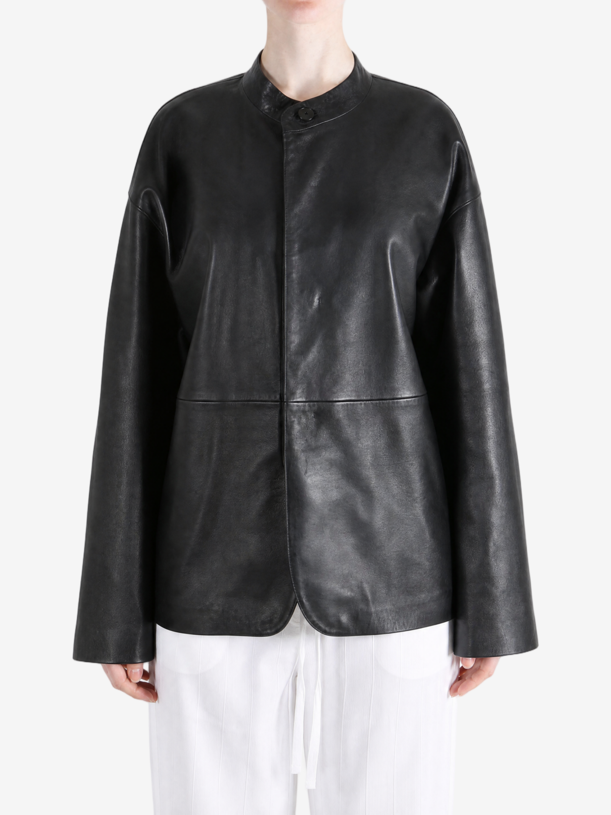 Black jacket worn by a person, showing the jacket fit