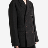 Black jacket worn by a person, showing the jacket fit