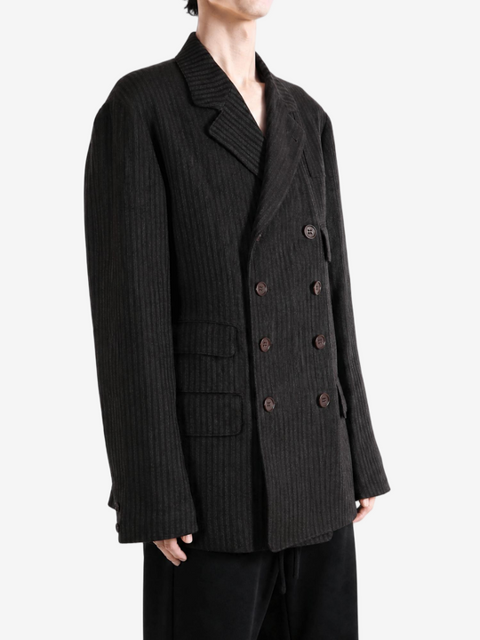 Black jacket worn by a person, showing the jacket fit