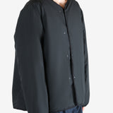 Black cardigan worn by a person, showing the cardigan's fit