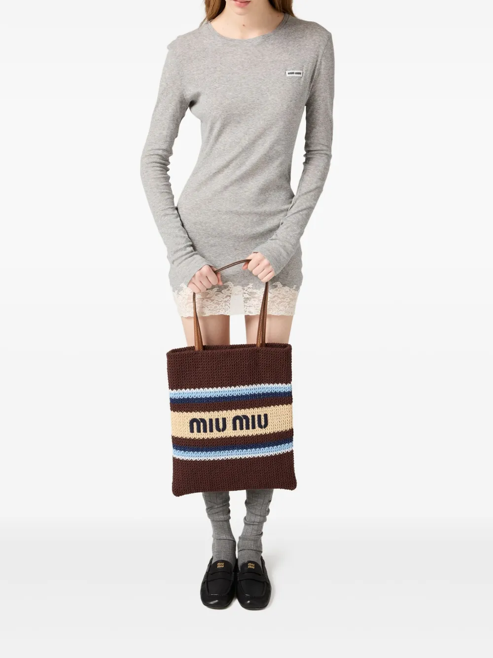 Brown bag carried by a person, showing the bag fit