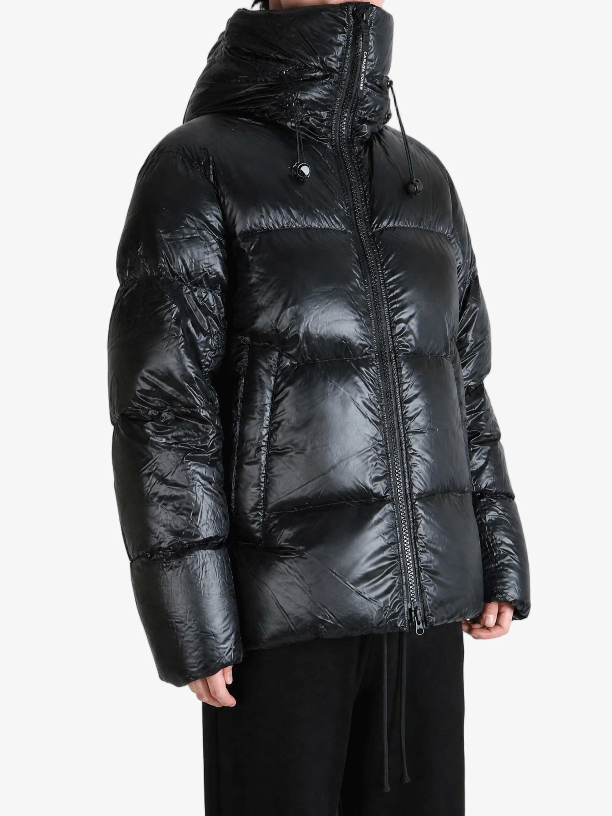 Black jacket worn by a person, showing the jacket fit