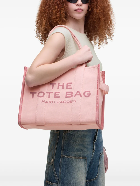 Pink bag, worn by a person, showing the bag's fit