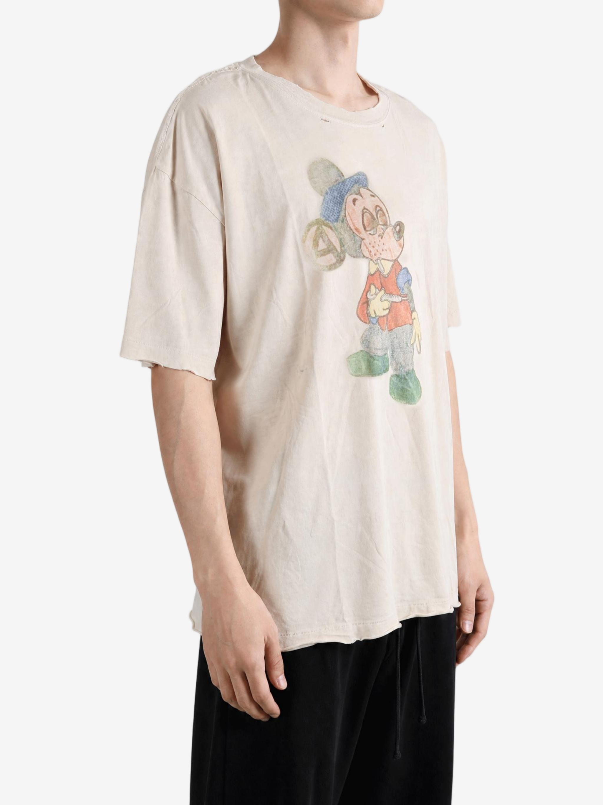 Tan t-shirt worn by a person, showing the t-shirt fit