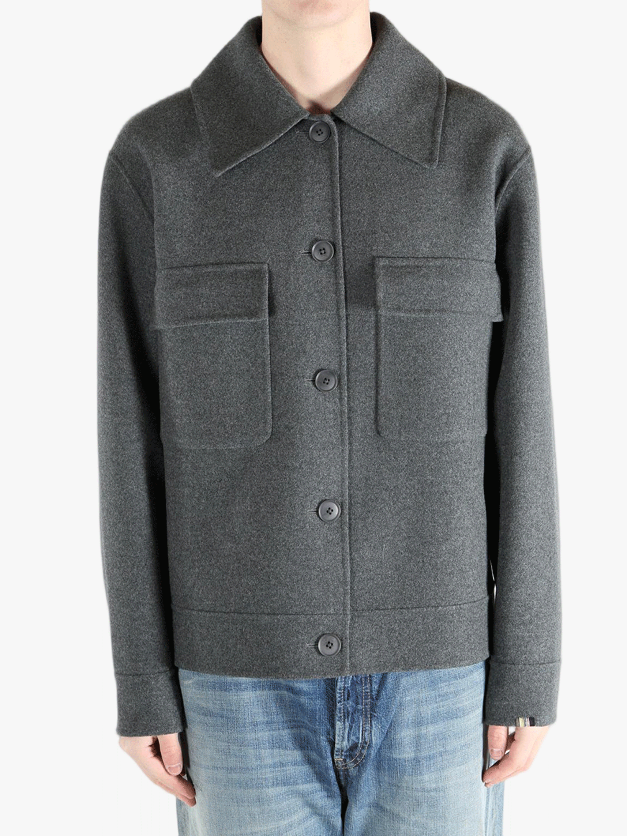 Grey jacket worn by a person, showing the pants fit