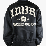 Black jacket worn by a person, showing the jacket's fit