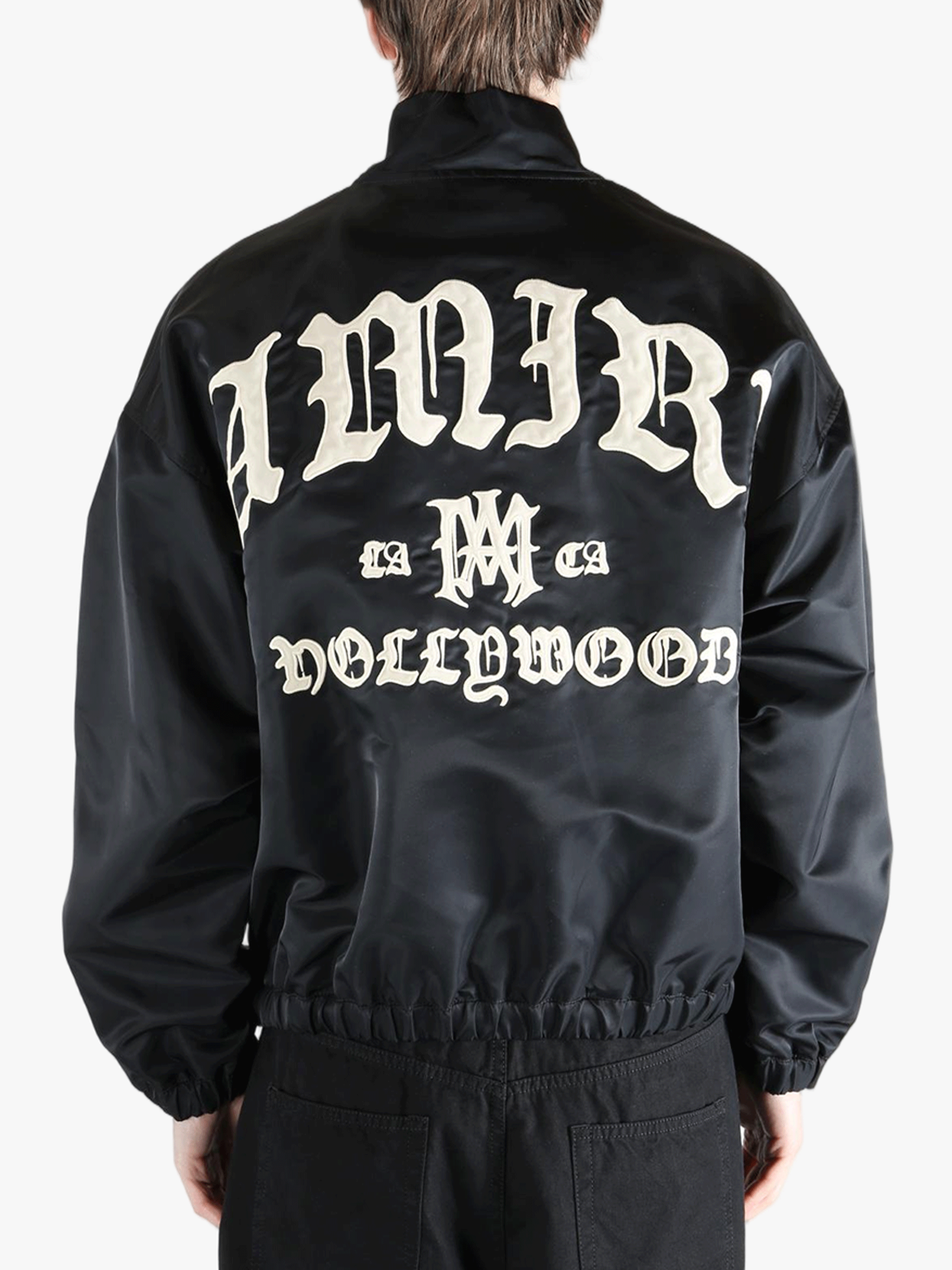 Black jacket worn by a person, showing the jacket's fit