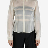 White shirt worn by a person, showing the shirt's fit
