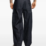 Blue pants worn by a person, showing the pants' fit