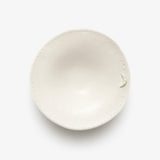 JINJIN PARIS Croissant Shallow Bowl in ivory porcelain, top view showing organic shape and dotted edge.