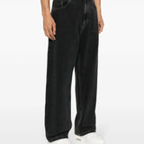 Blue pants worn by a person, showing the pants' fit