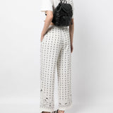 Black bag carried by a person, showing the bag’s fit