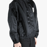 Black jacket worn by a person, showing the jacket's fit