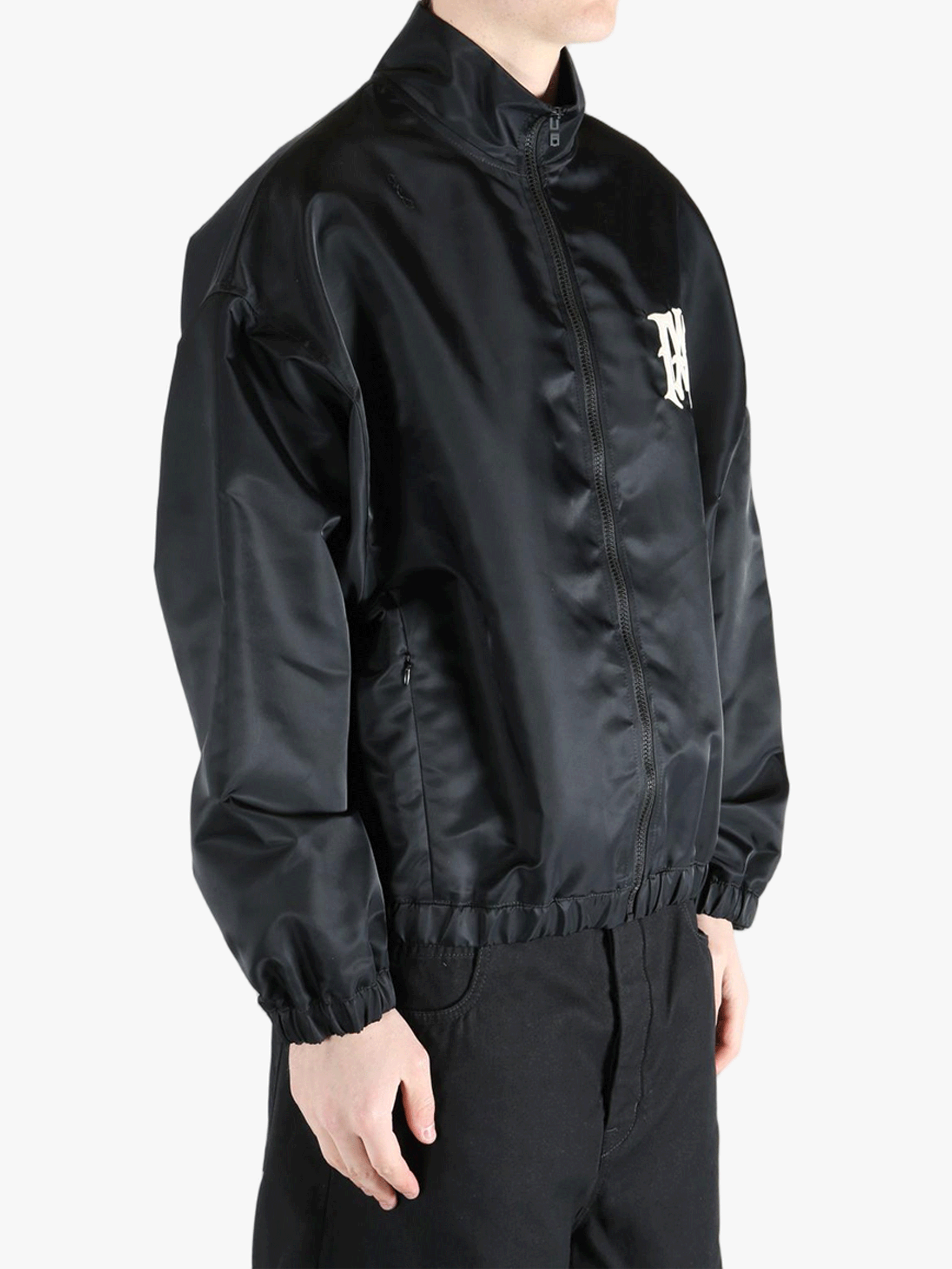 Black jacket worn by a person, showing the jacket's fit